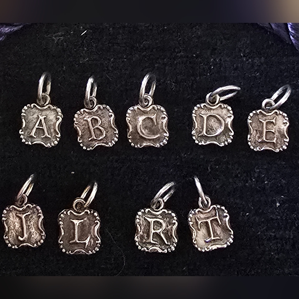 Waxing poetic crest charm